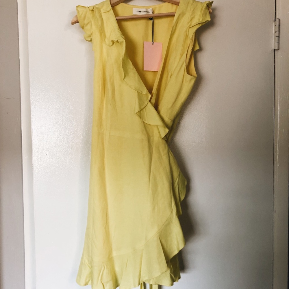 Fame & Partners yellow wrap mini dress